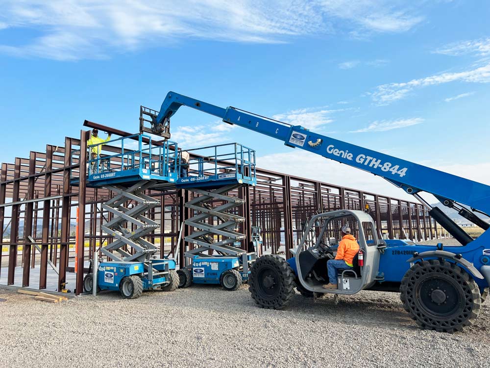 beams lifted by forklifts and Genie equipment